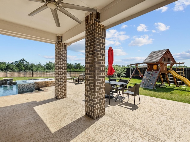 1800 Bright Way Ln, Dickinson, TX 77539 - view of patio / terrace featuring a playground, ceiling fan, outdoor dining space, and a pool with connected hot tub