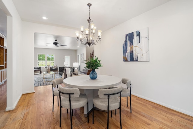 2350 Hewitt St, League City, TX 77573 - dining area with ceiling fan, baseboards, light wood-type flooring, a chandelier, and recessed lighting