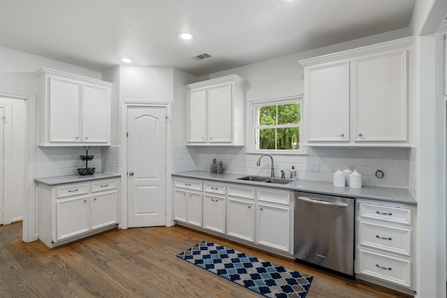 2350 Hewitt St, League City, TX 77573 - kitchen with dishwasher, a sink, wood finished floors, white cabinets, and recessed lighting