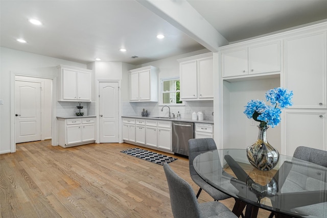 2350 Hewitt St, League City, TX 77573 - kitchen featuring dishwasher, a sink, tasteful backsplash, white cabinets, and recessed lighting