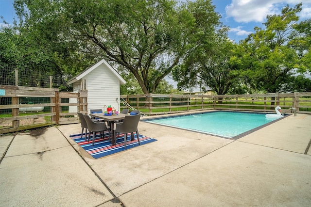 2350 Hewitt St, League City, TX 77573 - view of pool with a patio, fence, and outdoor dining space