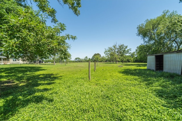 2350 Hewitt St, League City, TX 77573 - view of grassy yard with a pole building and an outbuilding