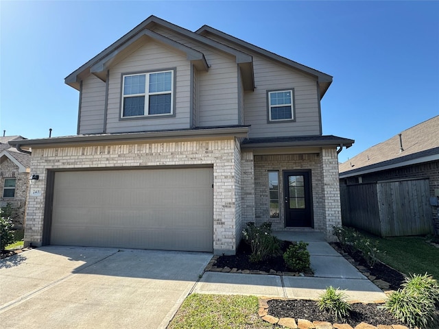 view of front of house featuring brick siding, an attached garage, fence, and concrete driveway