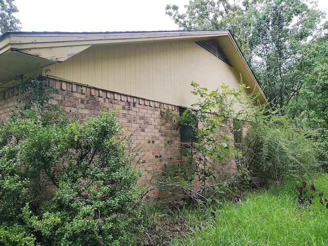 view of home's exterior featuring brick siding