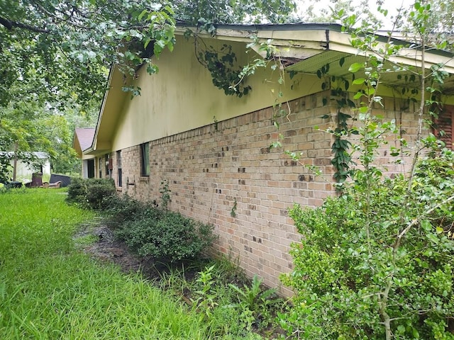 view of home's exterior featuring brick siding