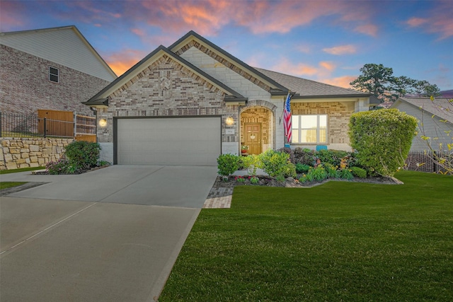 954 Golden Willow Ln, Conroe, TX 77304 - french country style house with an attached garage, driveway, and brick siding