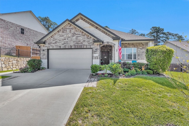 954 Golden Willow Ln, Conroe, TX 77304 - french country home featuring an attached garage, brick siding, and driveway