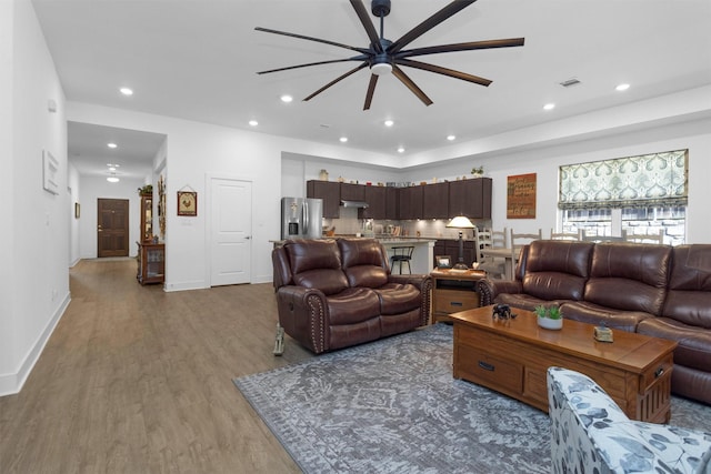 954 Golden Willow Ln, Conroe, TX 77304 - living area featuring a ceiling fan, wood finished floors, recessed lighting, and baseboards