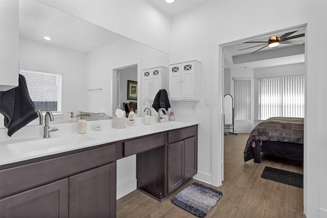 954 Golden Willow Ln, Conroe, TX 77304 - ensuite bathroom featuring double vanity, wood finished floors, ceiling fan, and baseboards