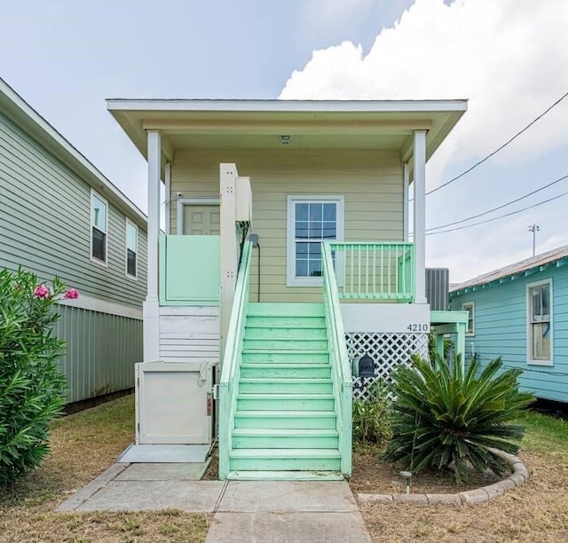 4210 Church St, Galveston, TX 77550 - rear view of house featuring a porch