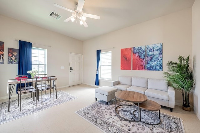 4210 Church St, Galveston, TX 77550 - living area with ceiling fan, baseboards, visible vents, and plenty of natural light