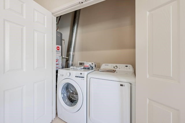 4210 Church St, Galveston, TX 77550 - laundry area featuring washer and dryer, laundry area, and water heater