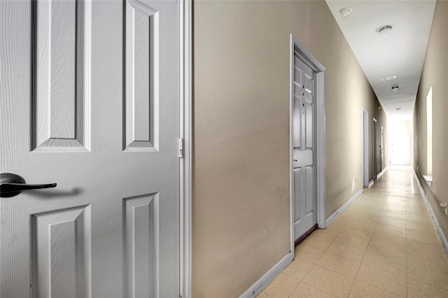4210 Church St, Galveston, TX 77550 - hallway with light tile patterned flooring and baseboards