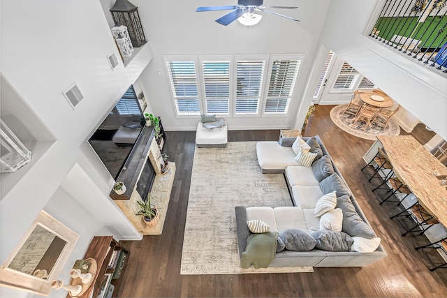 11710 Saporito Way, Richmond, TX 77406 - living area featuring a towering ceiling, ceiling fan, visible vents, and wood finished floors