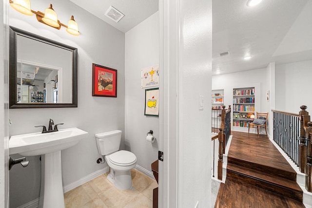 11710 Saporito Way, Richmond, TX 77406 - half bathroom with visible vents, toilet, recessed lighting, and baseboards