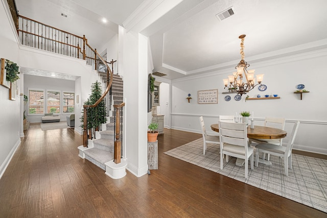 11710 Saporito Way, Richmond, TX 77406 - dining area featuring visible vents, baseboards, a notable chandelier, stairs, and wood-type flooring