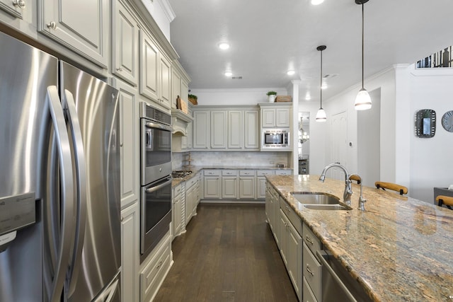11710 Saporito Way, Richmond, TX 77406 - kitchen featuring ornamental molding, backsplash, light stone countertops, stainless steel appliances, and a sink