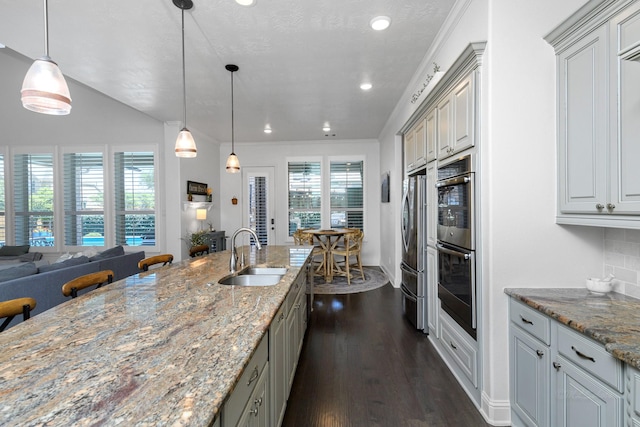 11710 Saporito Way, Richmond, TX 77406 - kitchen featuring recessed lighting, open floor plan, dark wood-style floors, backsplash, and a sink