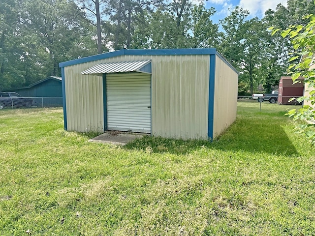 408 Redbud Rdg, Onalaska, TX 77360 - view of outdoor structure featuring fence and an outbuilding