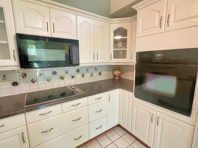 408 Redbud Rdg, Onalaska, TX 77360 - kitchen featuring glass insert cabinets, black appliances, and decorative backsplash