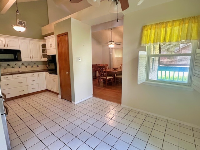 408 Redbud Rdg, Onalaska, TX 77360 - kitchen with black appliances, ceiling fan, decorative backsplash, and dark countertops