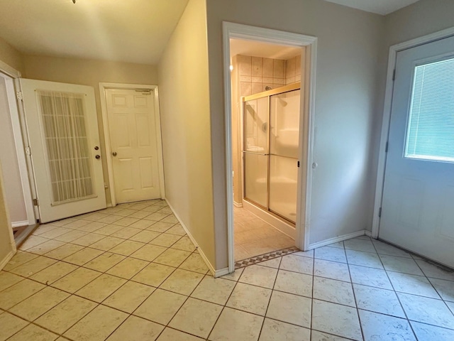 408 Redbud Rdg, Onalaska, TX 77360 - interior space with light tile patterned floors and baseboards