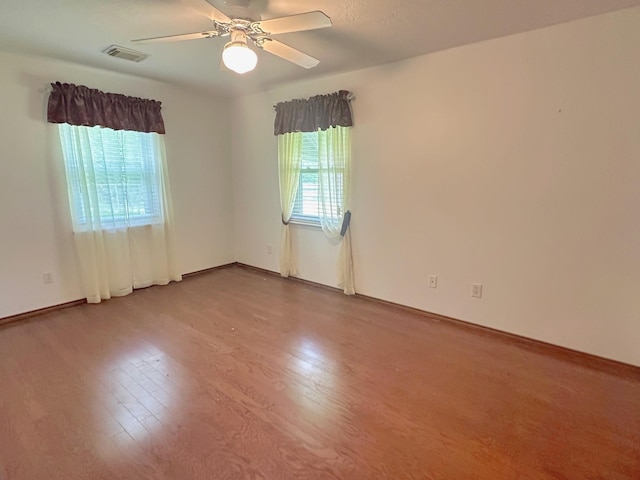 408 Redbud Rdg, Onalaska, TX 77360 - unfurnished room with baseboards, visible vents, wood finished floors, and a ceiling fan