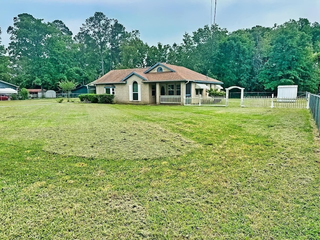 408 Redbud Rdg, Onalaska, TX 77360 - rear view of house with fence and a yard