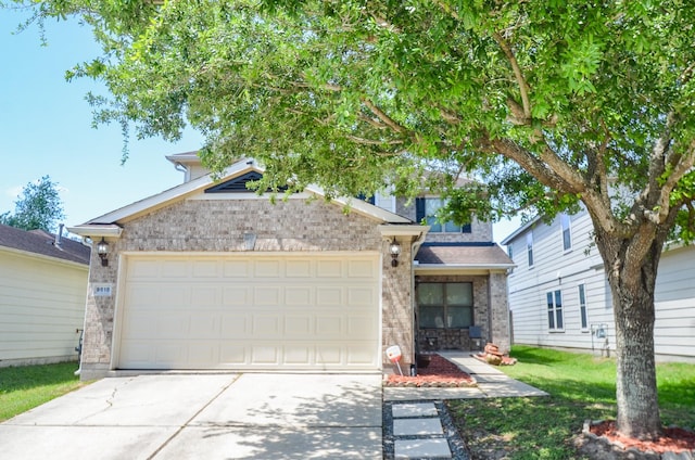 9518 Prairie Dale Ct, Houston, TX 77075 - view of front of home featuring brick siding, driveway, a garage, and a front yard