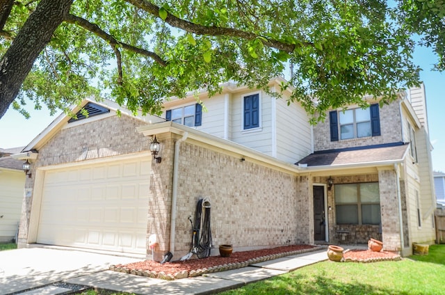 9518 Prairie Dale Ct, Houston, TX 77075 - view of front facade with a garage, brick siding, and driveway