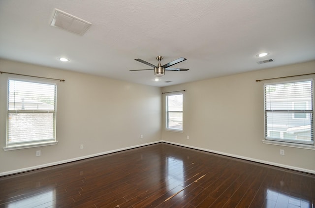 9518 Prairie Dale Ct, Houston, TX 77075 - unfurnished room featuring ceiling fan, baseboards, dark wood finished floors, recessed lighting, and healthy amount of natural light