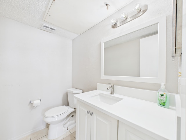 half bath featuring visible vents, baseboards, toilet, vanity, and tile patterned flooring