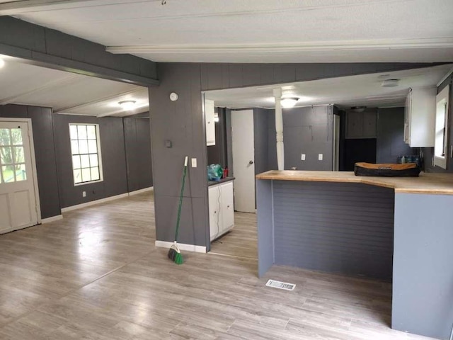 120 Greenridge Cir, Lufkin, TX 75904 - kitchen with light wood finished floors, baseboards, and white cabinetry