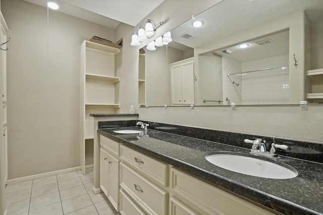 11711 Memorial Dr Unit 367, Houston, TX 77024 - full bathroom featuring tile patterned flooring, tiled shower, visible vents, and a sink