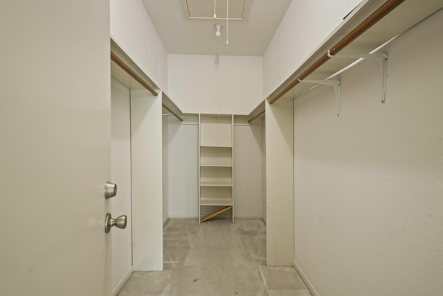 11711 Memorial Dr Unit 367, Houston, TX 77024 - walk in closet with light carpet and attic access