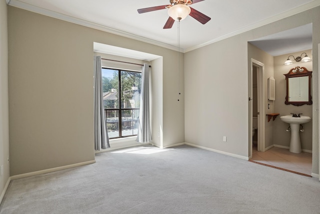 11711 Memorial Dr Unit 367, Houston, TX 77024 - unfurnished bedroom featuring a sink, carpet, baseboards, and ornamental molding