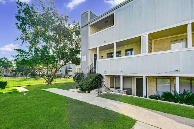 view of property with fence