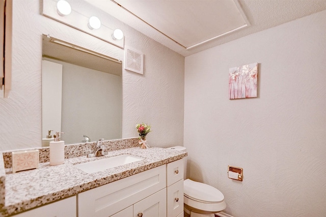 half bath with vanity and toilet
