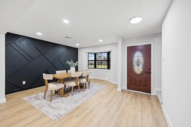 dining area with recessed lighting, light wood finished floors, visible vents, and baseboards