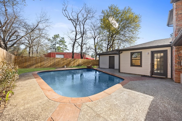 view of pool featuring a fenced backyard, a fenced in pool, and a patio