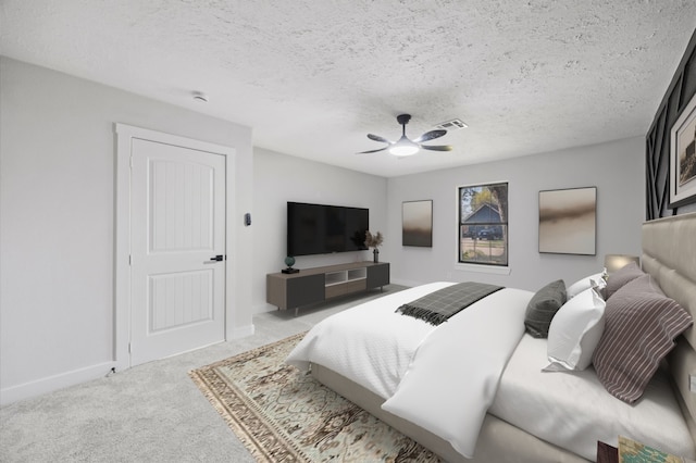 carpeted bedroom featuring visible vents, baseboards, a ceiling fan, and a textured ceiling