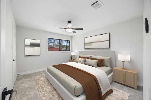 bedroom featuring light carpet, visible vents, baseboards, and a ceiling fan
