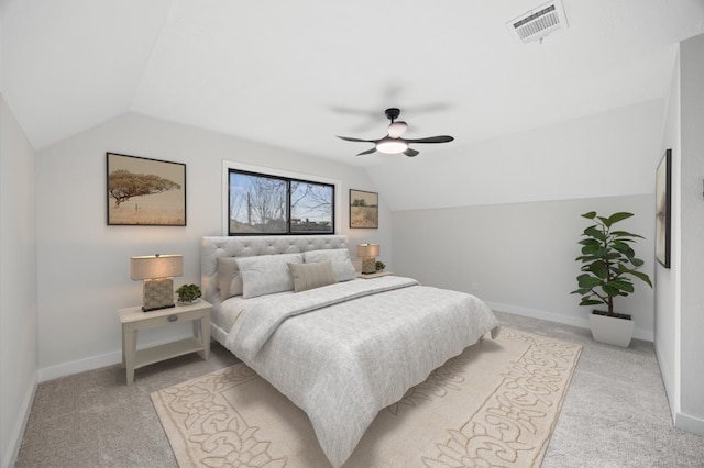 bedroom featuring ceiling fan, visible vents, light carpet, lofted ceiling, and baseboards