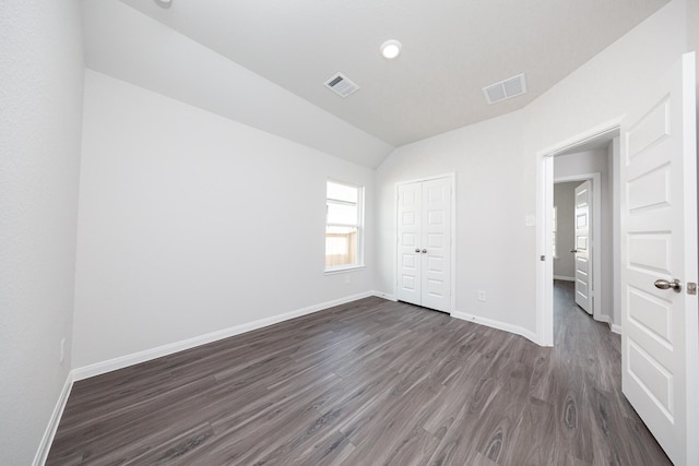 16547 Willow Forest Dr, Conroe, TX 77302 - unfurnished bedroom with dark wood-style floors, vaulted ceiling, a closet, and recessed lighting