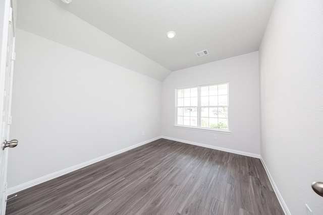 16547 Willow Forest Dr, Conroe, TX 77302 - empty room featuring dark wood-style flooring and lofted ceiling
