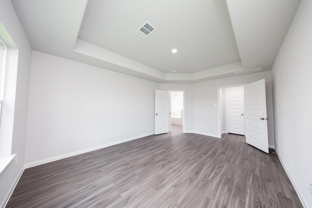 16547 Willow Forest Dr, Conroe, TX 77302 - unfurnished bedroom featuring a raised ceiling, wood finished floors, and recessed lighting