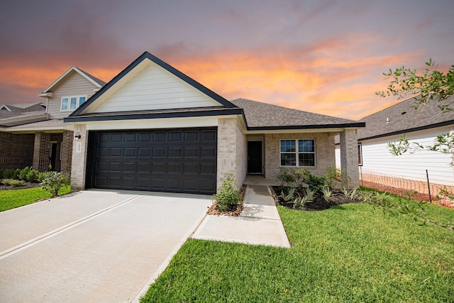 16547 Willow Forest Dr, Conroe, TX 77302 - view of front facade featuring a garage, driveway, and brick siding