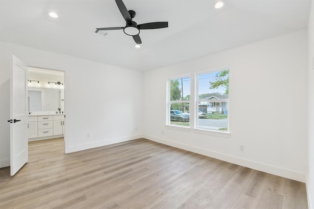 5338 Pease St, Houston, TX 77023 - unfurnished bedroom featuring light wood-type flooring, ensuite bathroom, baseboards, and recessed lighting