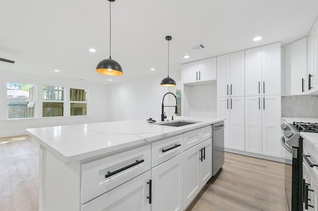 5338 Pease St, Houston, TX 77023 - kitchen with visible vents, recessed lighting, dishwasher, a sink, and gas range oven
