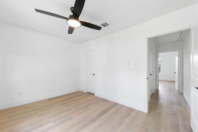 5338 Pease St, Houston, TX 77023 - empty room featuring light wood-type flooring, a ceiling fan, visible vents, attic access, and baseboards